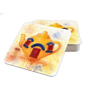 May include: Set of four yellow and blue teapot-shaped coasters with a red door and windows. The coasters are painted in a watercolour style and have a whimsical design.