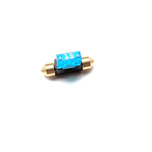 May include: A blue 15-amp automotive fuse with gold-colored end caps and a black base. The fuse is designed to protect electrical circuits from overcurrent.