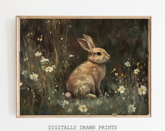 May include: A vintage-style print featuring a light brown rabbit sitting in a field of white wildflowers. The artwork has a dark, moody background and is framed in a wooden border. Text at the bottom reads "DIGITALLY DRAWN PRINTS Vintage Printable Wall Art."