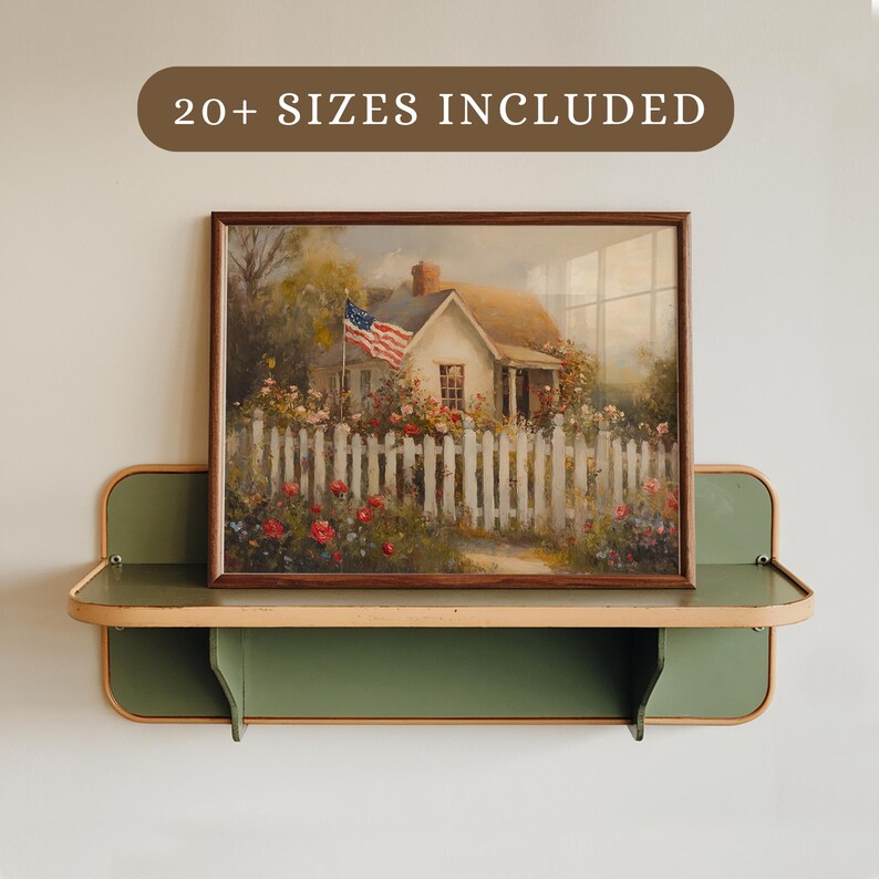 May include: A green shelf with a wooden top, featuring a framed painting of a white house with a picket fence and an American flag. The painting is set against a backdrop of lush greenery and flowers. The text "20+ SIZES INCLUDED" is displayed on a brown label above the shelf.