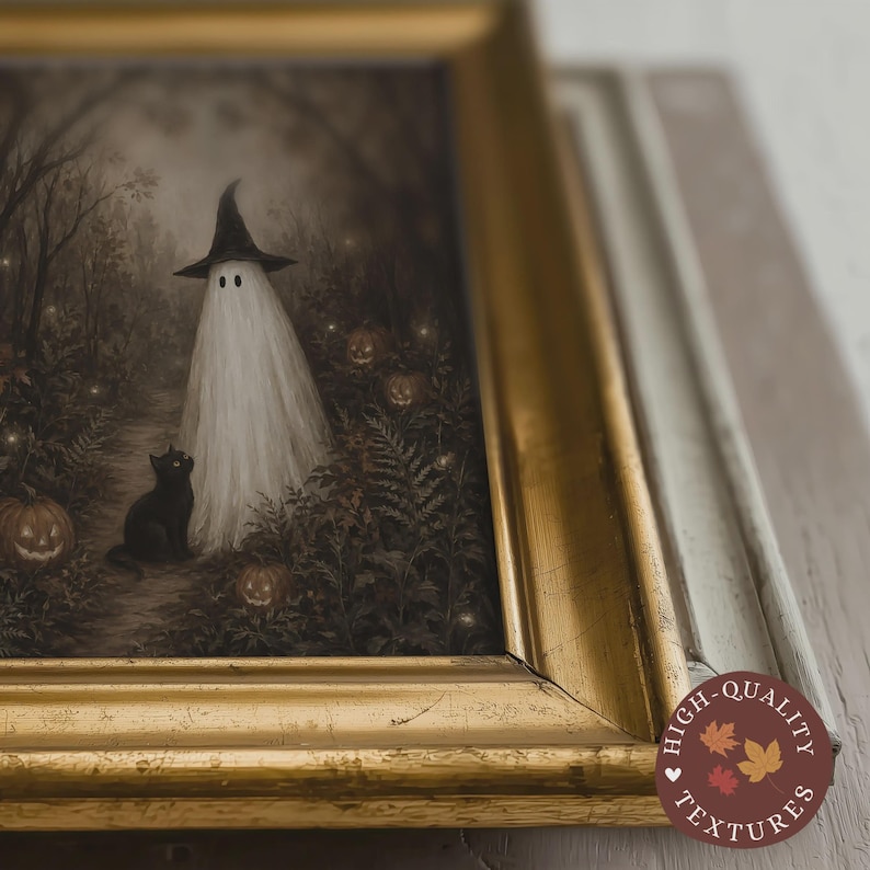 May include: A framed wall art print featuring a white ghost wearing a black pointed hat standing in a dark forest with a black cat and orange jack-o'-lanterns. The artwork is encased in a metallic gold frame with a distressed finish.
