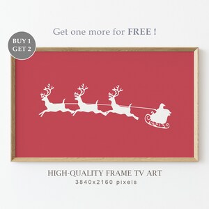 Puede incluir: Una silueta blanca de Pap&aacute; Noel montando en un trineo tirado por tres renos sobre un fondo rojo. La imagen est&aacute; enmarcada y tiene el texto "Get one more for FREE!" y "HIGH-QUALITY FRAME TV ART 3840x2160 pixels" debajo de la imagen.