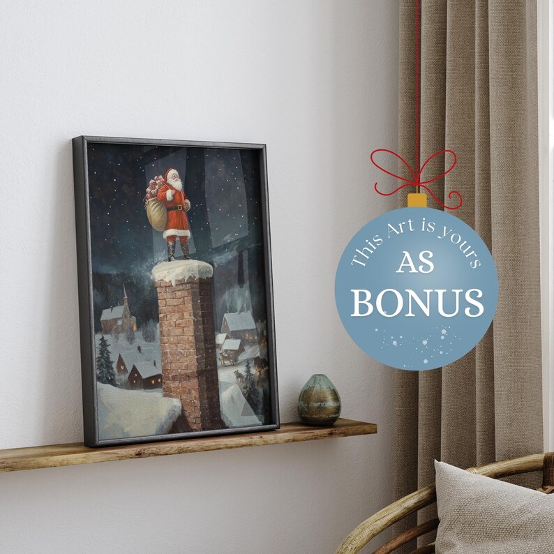 May include: A framed painting of Santa Claus climbing a chimney in a snowy village at night. The painting is in a black frame and is hanging on a wooden shelf. The text "This Art is yours AS BONUS" is on a blue circle with a red ribbon.