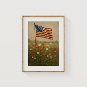 May include: Framed print of an American flag waving in a field of wildflowers. The flag has red and white stripes and a blue canton with white stars. The flowers are red, white, and blue.