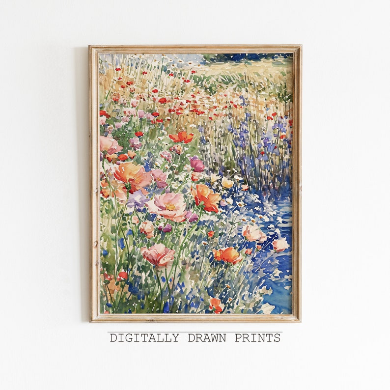 Pode incluir: Uma pintura em aquarela de um campo de flores silvestres, incluindo papoulas, em tons de rosa, vermelho, laranja e amarelo. As flores crescem ao longo de um riacho de &aacute;gua azul. A pintura &eacute; emoldurada em uma moldura de madeira clara.