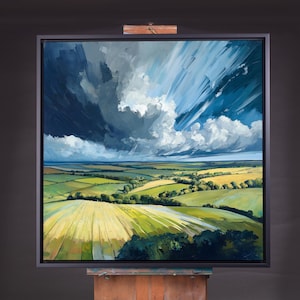 Peut inclure: Une peinture représentant un paysage avec des collines et des champs vallonnés. Le ciel est d'un bleu dramatique avec des nuages blancs et des traînées de lumière. La peinture est encadrée de noir.