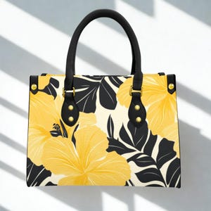 Bolso de mano Tropical Hibiscus, estructura amarilla y negra, con herrajes dorados y bolsillo con cremallera, elegante bolso de verano.