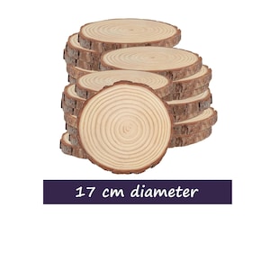 May include: A pile of natural wood slices, each showing growth rings and bark edges. The image text states "17 cm diameter". These rustic wood rounds are ideal for crafts and home decor projects.