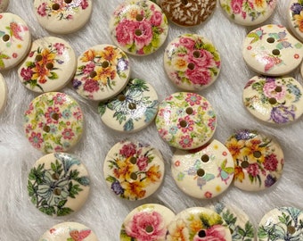 May include: Assortment of wooden buttons with floral and butterfly designs. The buttons are in various colors, including pink, blue, green, and yellow.