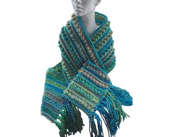 Chunky crochet scarf in bright jewel colours with fringe and bobble design.