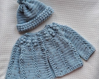 Baby's Aran jacket and hat set in duck egg blue. 6 - 12 months