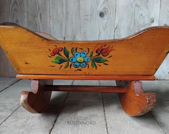 Small antique handpainted dolls rocking cradle from Sweden. Dated 1915