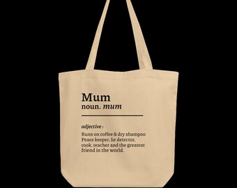 May include: Beige tote bag with a black print that reads "Mum noun. mum adjective: Runs on coffee & dry shampoo Peace keeper, lie detector, cook, teacher and the greatest friend in the world."