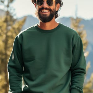 May include: A dark green crew neck sweatshirt with long sleeves. The sweatshirt is made of a soft, comfortable fabric.