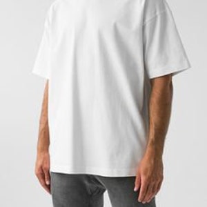 May include: An oversized white t-shirt with a crew neck and short sleeves.