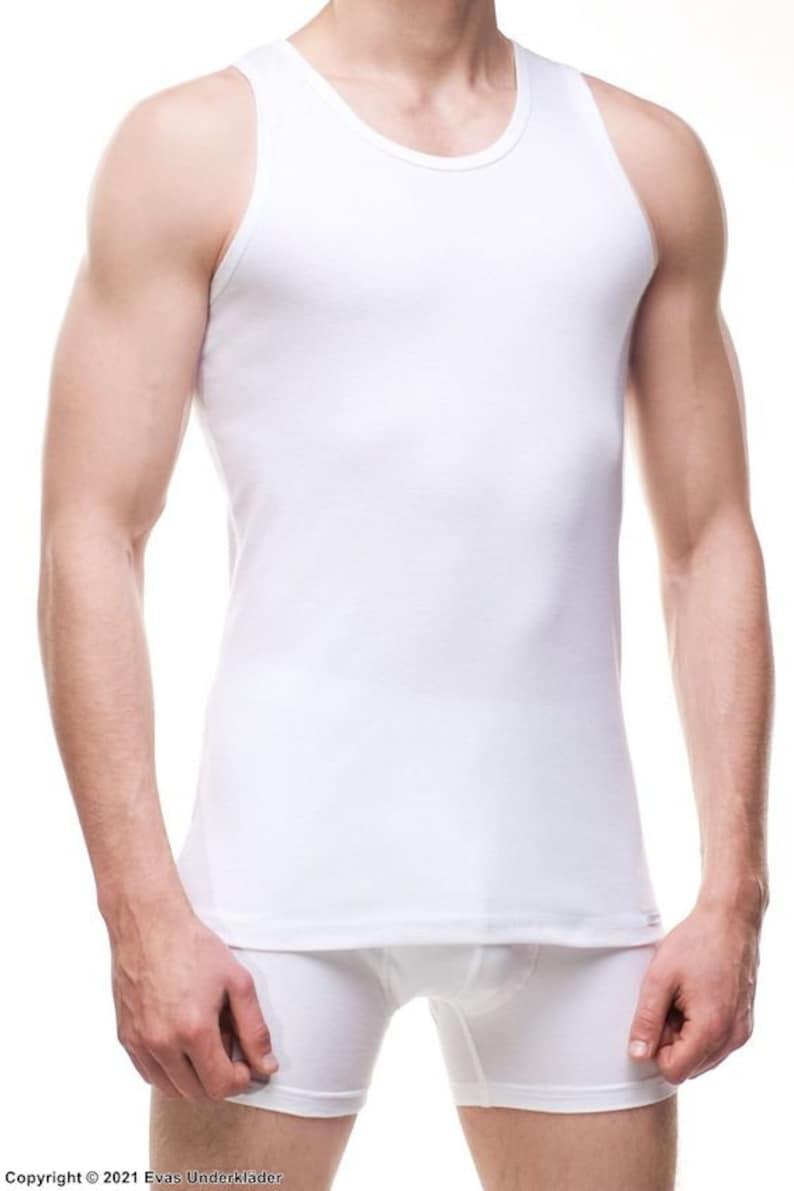 May include: White sleeveless undershirt with a crew neck.