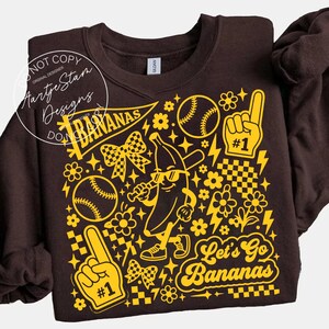 Let's go bananas PNG DTF transfer sublimation Savannah Bananas baseball sweatshirt brown crewneck retro funny baseball tee baseball mom gift game day shirt banana mascot coquette checkered bow yellow crewneck retro sport women funny baseball gift little league shirt team spirit crewneck spring baseball gift lightning bolt baseball babe sweatshirt