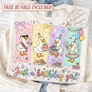 May include: Cream-colored sweatshirt with a colorful graphic of four cartoon ducks celebrating a birthday. Each duck is in a different panel with birthday-themed elements. Text reads "Just a birthday girl!" and "Free Bundle Included".