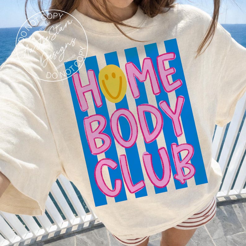 Homebody Club shirt PNG retro Y2K bold bubble letter smiley face blue stripe pink text, on cream oversized crewneck sweatshirt worn ocean balcony, soft girl Pinterest aesthetic procrastination humor funny saying shirt wine mom cruise homebody, for DTF transfers, sublimation shirts, tumblers, apparel printing.