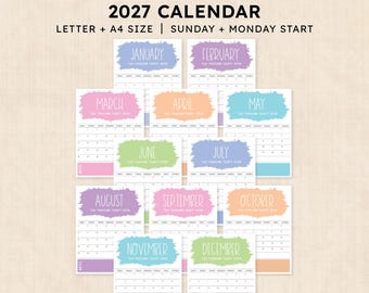 May include: A printable 2027 calendar set featuring twelve monthly pages in Letter and A4 sizes with Sunday and Monday start options. Each page displays a month name in a white brushstroke graphic with pastel colour accents and a grid layout.