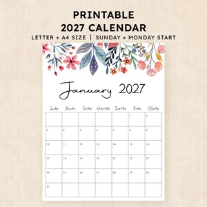 Puede incluir: Una página de calendario imprimible para enero de 2027 con un borde floral de acuarela en la parte superior con flores y hojas rojas, azules y naranjas. El texto dice PRINTABLE 2027 CALENDAR, LETTER + A4 SIZE, SUNDAY + MONDAY START, January 2027.