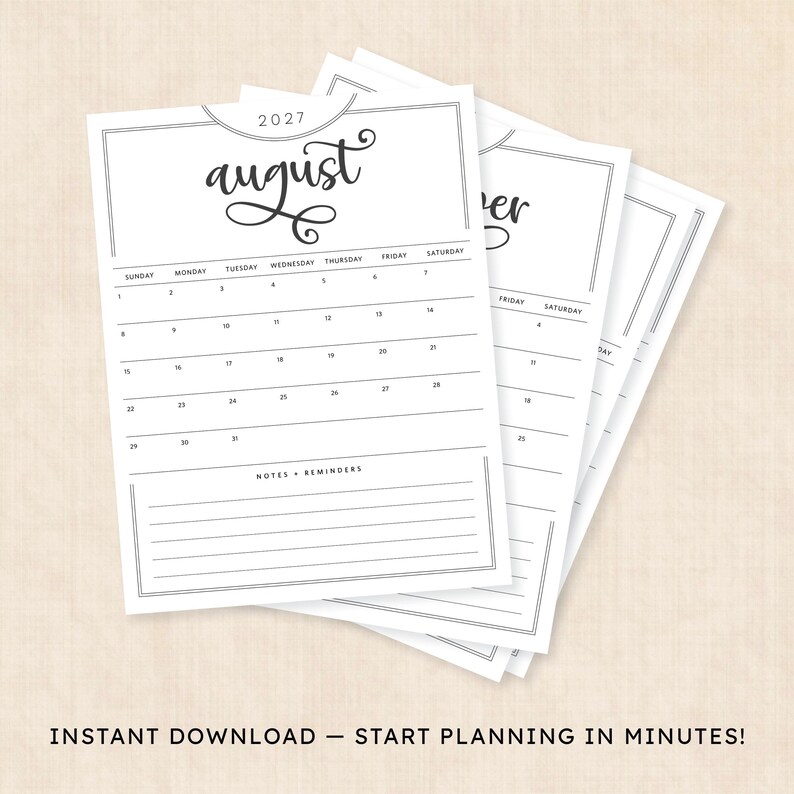 May include: A stack of white paper calendar pages for August 2027, featuring black text and lines. The top page displays the month name in script, a grid with days of the week, numbered dates, and a section at the bottom labeled Notes + Reminders.