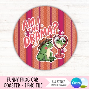 May include: A round pink and orange coaster with a white chevron pattern. A green frog wearing a brown hat is looking at its reflection in a heart-shaped mirror. The text "Am I the Drama?" is written in white letters on the coaster.