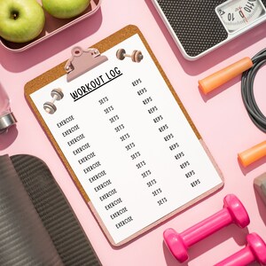 May include: A pink workout log with a cork board backing and a clipboard. The log has a list of exercises and sets and reps for each exercise. There are dumbbells, a jump rope, and scales in the background.