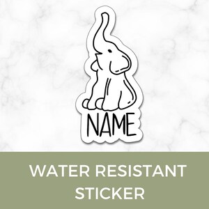 May include: A white water-resistant sticker featuring a black line drawing of a sitting elephant with its trunk raised. The word "NAME" is below the elephant. The text "WATER RESISTANT STICKER" is at the bottom.