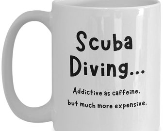 May include: White ceramic coffee mug with black text that reads "Scuba Diving... Addictive as caffeine, but much more expensive."