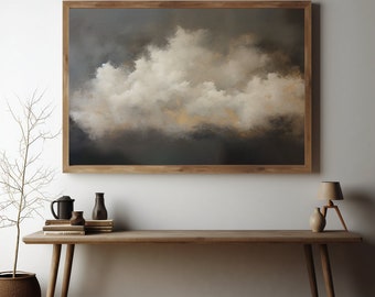 May include: A framed painting of a large, white cloud formation against a dark gray sky. The painting is hanging on a white wall above a wooden table with a vase, a pitcher, and a lamp.