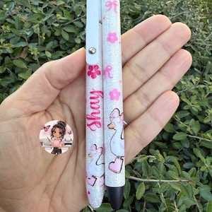 May include: A white ceramic mug with a black handle and the text "But First, Coffee" in a bold, black font. The mug is set against a blurred background, suggesting a cozy setting. The mug appears to be approximately 4 inches tall.