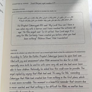May include: Open book with text in English and Arabic. The text includes a verse from Surah Maryam and its translation. The page also contains commentary and explanation of the verse.