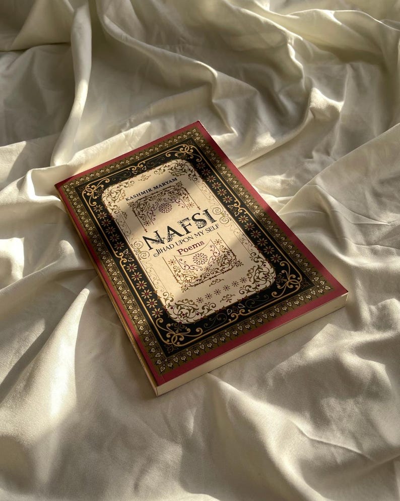 May include: A book titled "NAFSI: JIHAD UPON MY SELF Poems" by Kashimik Makyam. The book cover features an ornate, gold and black frame with intricate floral designs.