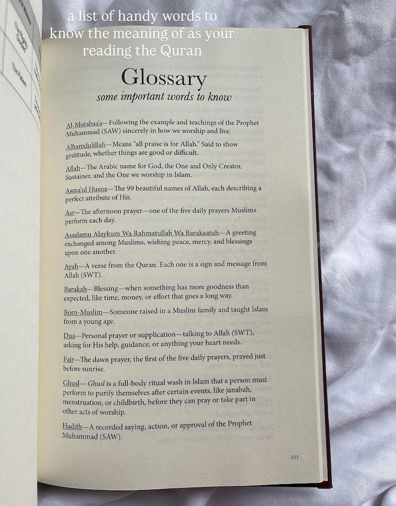 May include: Open book with a glossary of Islamic terms. The page displays a list of words and their definitions, including "Alhamdulillah," "Allah," and "Asma'ul Husna." The text is in black font on a cream-colored page.