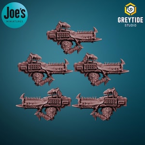 May include: Five brown miniature weapons with intricate details, possibly for tabletop gaming or model building. The weapons have a futuristic design with spikes and mechanical elements. The image includes the text "Joe's Miniatures" and "Greytide Studio".
