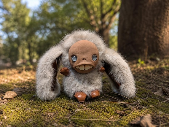 A handmade monster plush small enough to dangle from your bag — the 'Moglet' is genuinely unsettling in the best possible way.