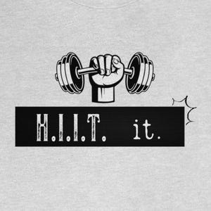 May include: A gray t-shirt with a black and white graphic of a hand lifting a barbell with the text "H.I.I.T. it." printed below.