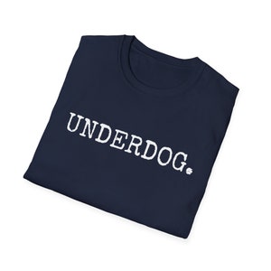 May include: A navy blue t-shirt with the word "UNDERDOG." printed in white.
