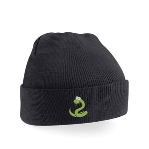 May include: A black knitted beanie with a green snake embroidered on the front. The snake has white eyes and a red tongue.