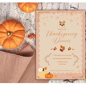 May include: Thanksgiving dinner invitation with pumpkins and fall foliage. The invitation is peach-colored with decorative elements and text that reads "Join Us For Thanksgiving Dinner" and event details. Two orange pumpkins and a folded brown cloth are also in the image.