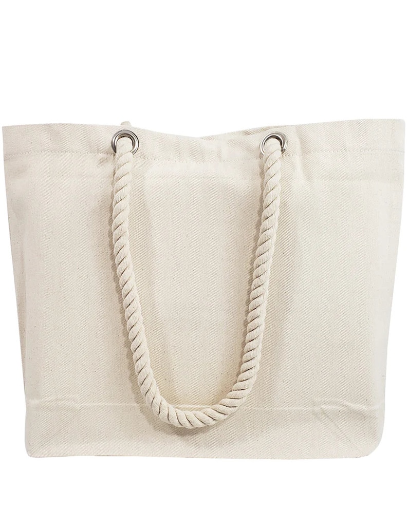May include: A cream-colored tote bag with a rectangular shape. The bag features a thick, twisted rope handle attached with silver metal grommets. The bag is made of a sturdy canvas material, suitable for carrying various items.