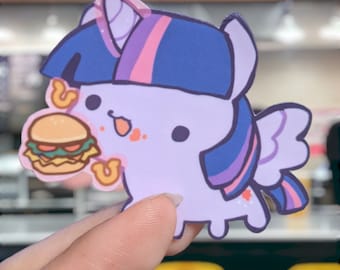 May include: A sticker featuring a cartoon pony with a purple body, blue and purple hair, and a burger. The pony has a cute expression and is holding the burger with its front hooves. The burger has a bun, patty, lettuce, and tomato.