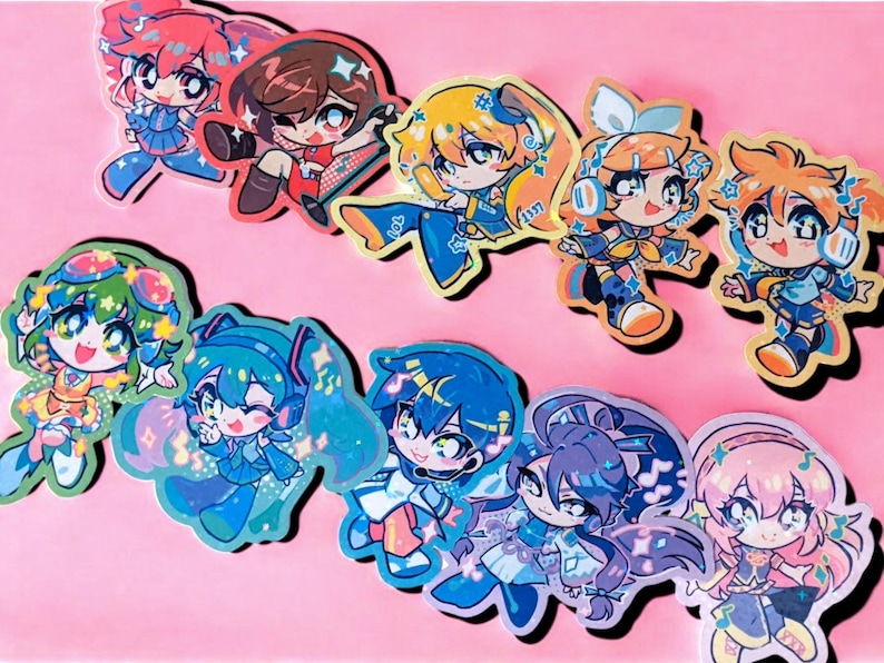 May include: A collection of colorful anime-style stickers featuring various characters with vibrant hair and outfits. The stickers have a glossy finish and are arranged on a pink background. Each character has a unique design.