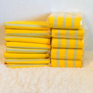 yellow Aso Oke bundles for wedding dress