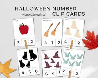 Puede incluir: Tarjetas de pinza con números temáticas de Halloween, con ilustraciones de manzana, escobas, fantasmas, gatos, sombreros de bruja y búhos. Cada tarjeta muestra un número e imágenes correspondientes. El texto "digital download" está en la parte superior.
