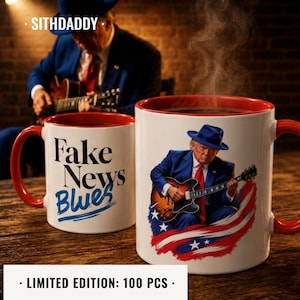 May include: Two white ceramic mugs with red interiors and handles. One mug features the text Fake News Blues in black and blue font. The other mug displays a graphic of a person in a blue suit and hat playing a guitar over a red, white, and blue design.
