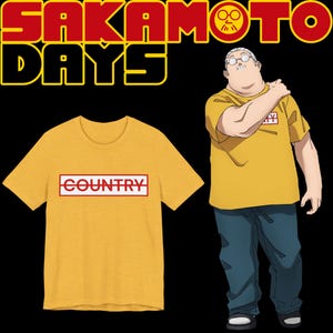 May include: Mustard yellow t-shirt with the word "COUNTRY" in a red-bordered white rectangle. The image also features a cartoon character wearing a similar yellow shirt and blue jeans, with the words "SAKAMOTO DAYS" in red and black.