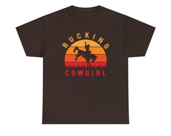 Bucking Cowgirl Shirt - Saddle up and embrace your wild side with our "Bucking Cowgirl Tee"!