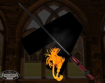 May include: A black and red wooden wand with a gold tassel, displayed on a black velvet pouch. The wand is approximately 13 inches long.